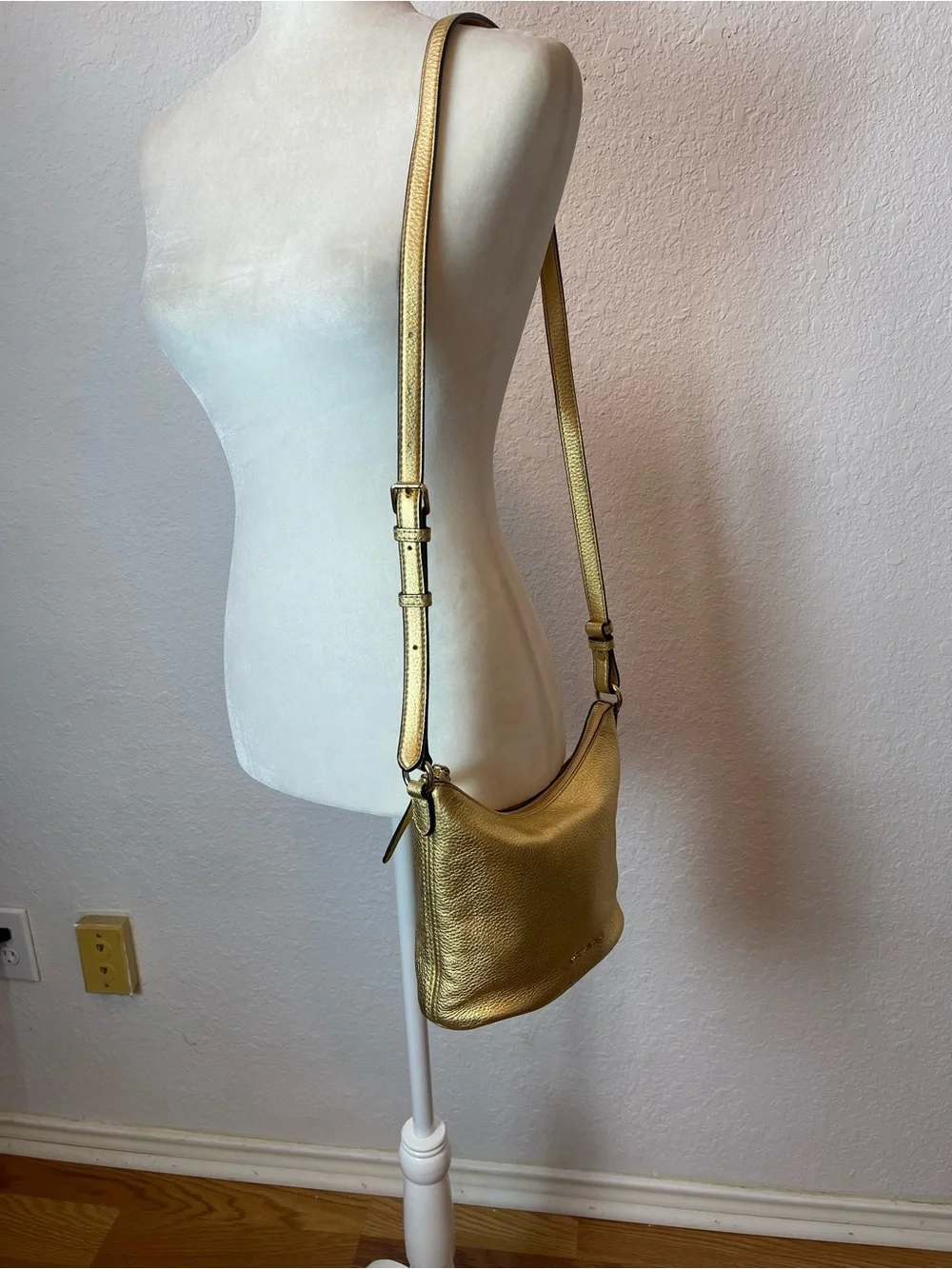 Michael Kors Gold leather hobo crossbody bag.